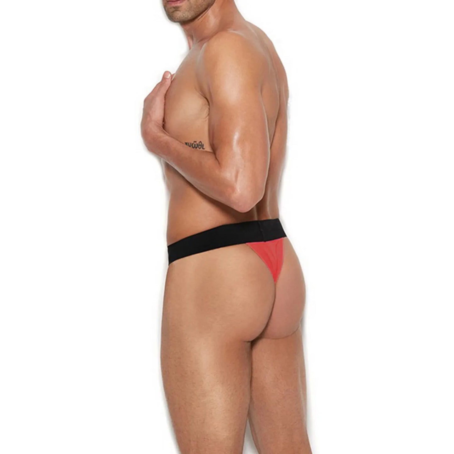 Model wearing a premium men's black athletic jockstrap featuring a wide elastic waistband and supportive front pouch for a modern fit.