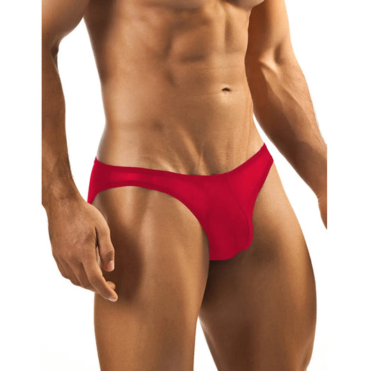 Model wearing premium men's onyx black low-rise bikini briefs in a sheer mesh stretch fabric with a supportive contoured pouch.
