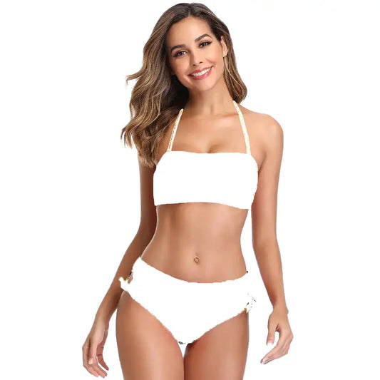 Woman wearing a white bikini on a white background