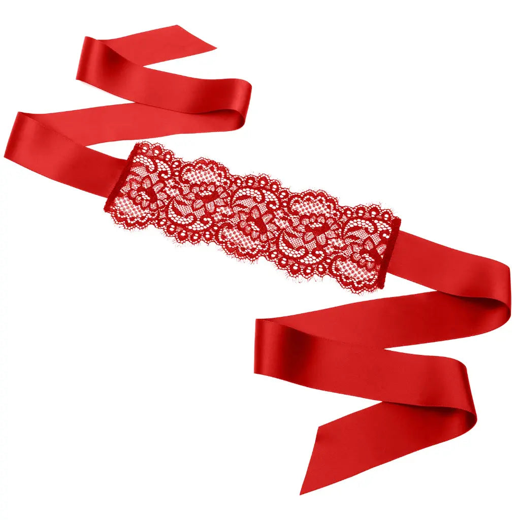 Black floral lace blindfold with satin ribbon tie for elegant sensory play and roleplay.
