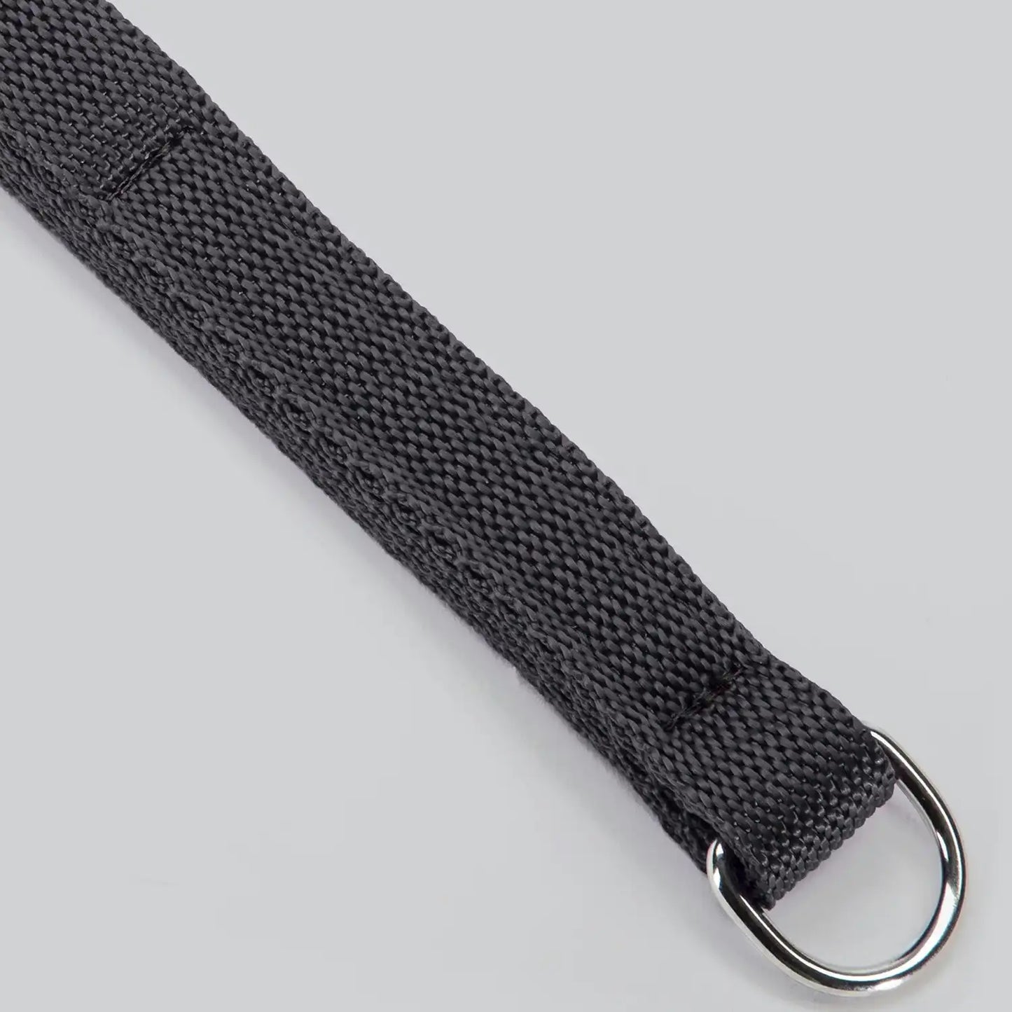 Black nylon flogger with multiple flexible woven tails and comfortable wrapped handle.