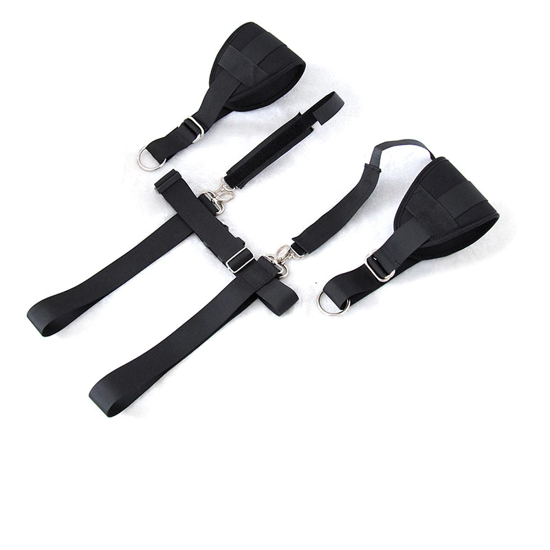 Adjustable black body restraint harness kit with wrist and thigh cuffs connected by durable nylon straps.