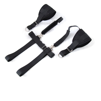 Adjustable black body restraint harness kit with wrist and thigh cuffs connected by durable nylon straps.