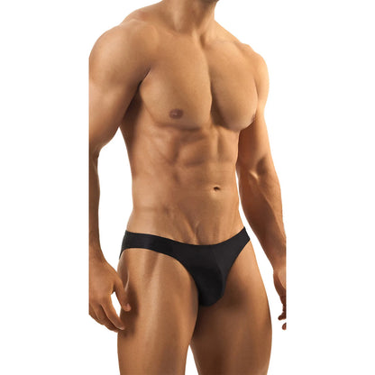 Model wearing premium men's low-rise bikini briefs in sleek black stretch fabric for a comfortable and modern fit.