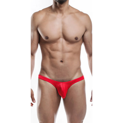  Model wearing a premium men's radiant red G-string thong with a supportive contoured pouch and sleek minimalist waistband for a comfortable fit.