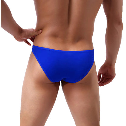Model wearing premium men's black low-rise bikini briefs featuring a unique red integrated support ring and a contoured pouch for a modern fit.