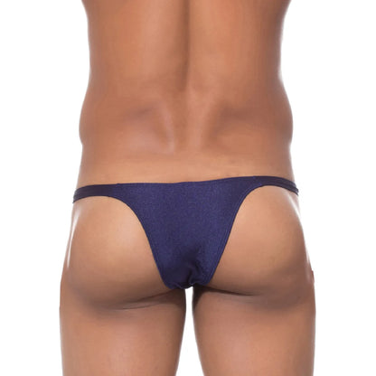  Model wearing a premium men's navy blue micro thong with a sleek low-rise waistband and supportive contoured pouch for an invisible fit under clothing.
