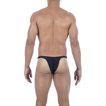  Model wearing premium men's onyx black micro thong with a sleek low-rise waistband and supportive contoured pouch for a seamless fit.