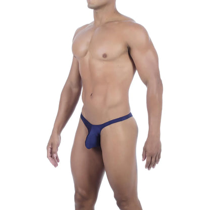  Model wearing premium men's onyx black micro thong with a sleek low-rise waistband and supportive contoured pouch for a seamless fit.