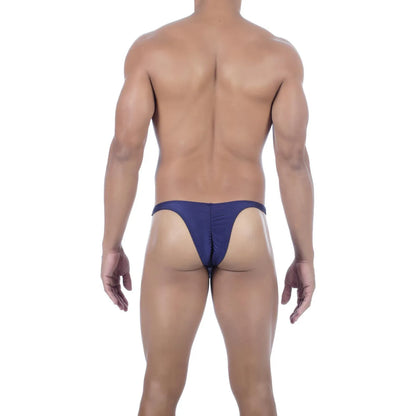  Model wearing premium men's onyx black micro thong with a sleek low-rise waistband and supportive contoured pouch for a seamless fit.