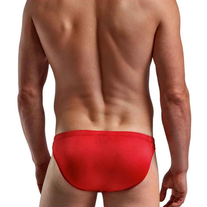  Model demonstrating the quick-release side-clip feature on premium men's black low-rise bikini briefs with a supportive contoured pouch.