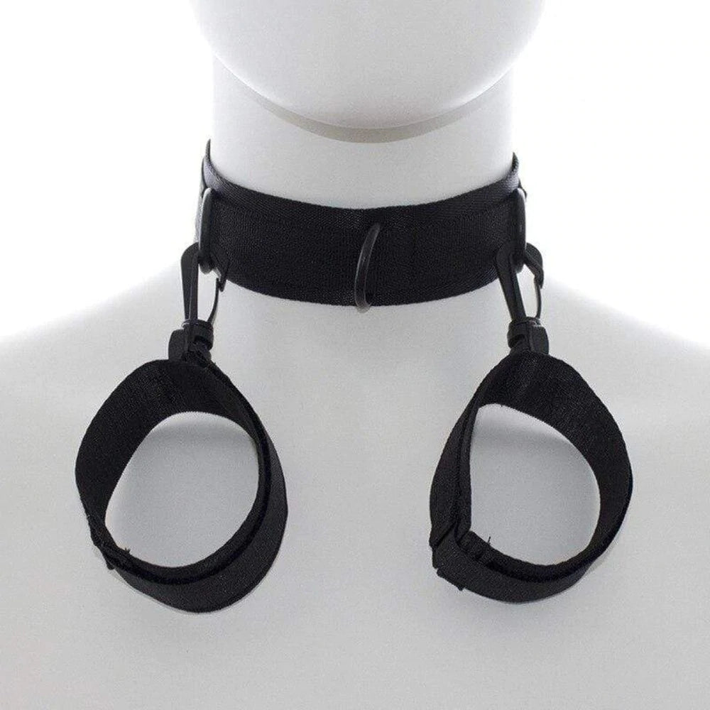 Black adjustable neck collar connected to matching wrist cuffs with durable metal clips.