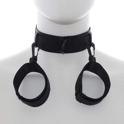 Black adjustable neck collar connected to matching wrist cuffs with durable metal clips.