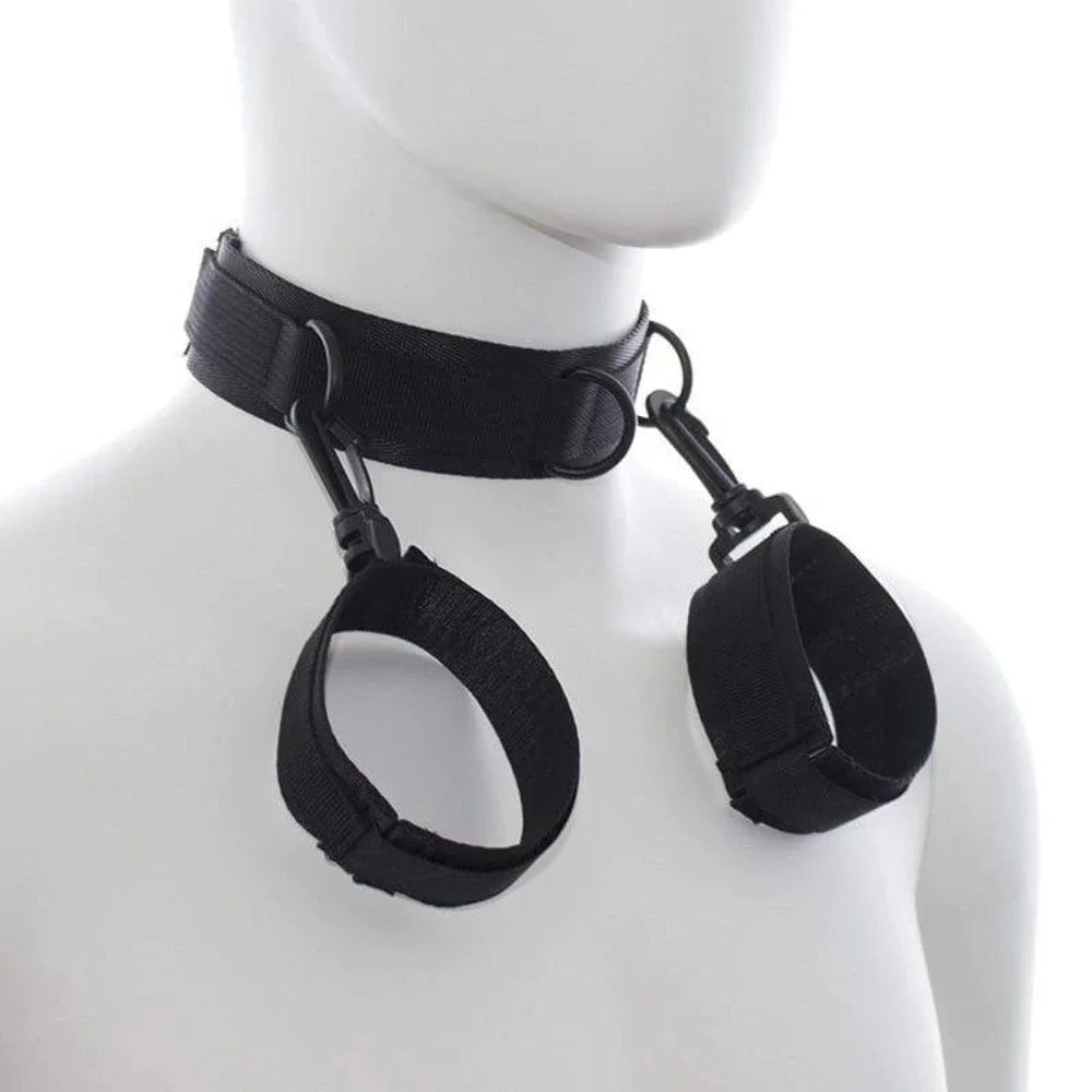 Black adjustable neck collar connected to matching wrist cuffs with durable metal clips.