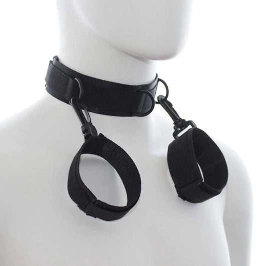 Black adjustable neck collar connected to matching wrist cuffs with durable metal clips.