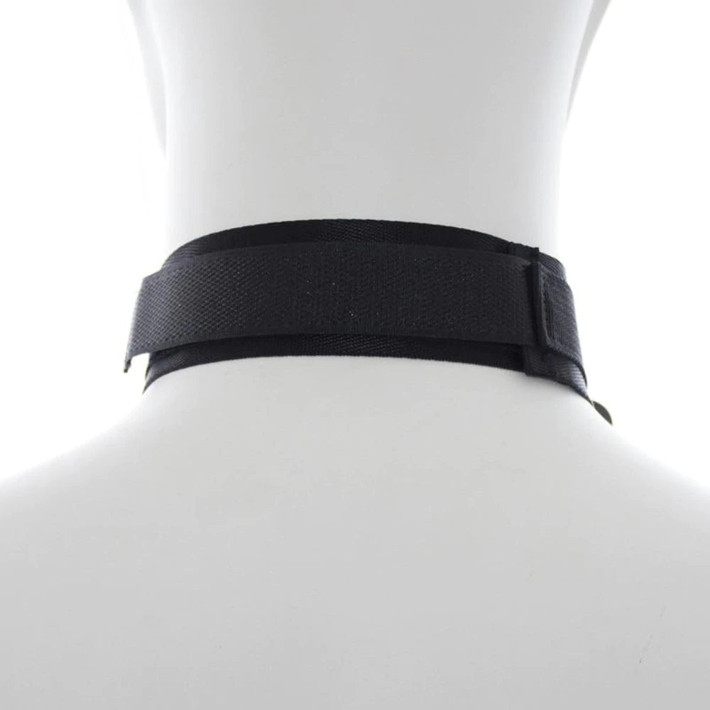 Black adjustable neck collar connected to matching wrist cuffs with durable metal clips.