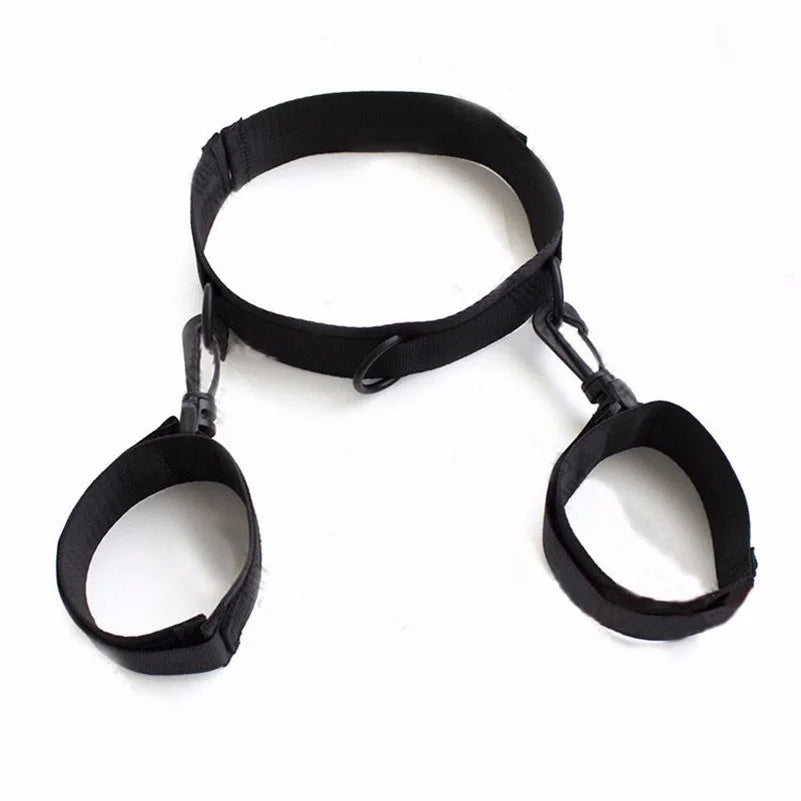 Black adjustable neck collar connected to matching wrist cuffs with durable metal clips.