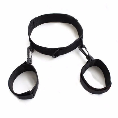 Black adjustable neck collar connected to matching wrist cuffs with durable metal clips.
