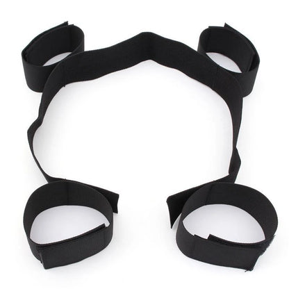 Adjustable black spreader bar restraint kit with wrist cuffs and ankle cuffs connected by secure straps.