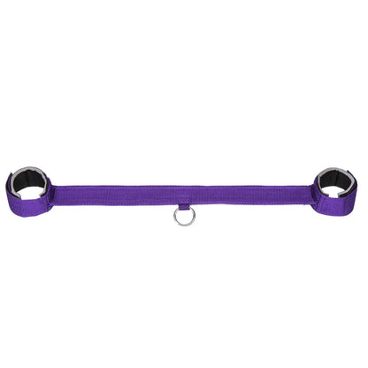 Purple wrist and ankle restraint set with adjustable straps and central metal ring.
