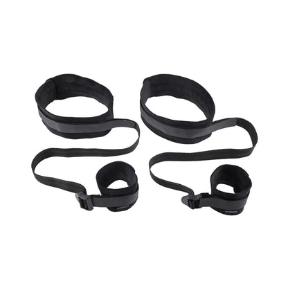 Adjustable black wrist and thigh restraint set with padded cuffs and connecting straps.