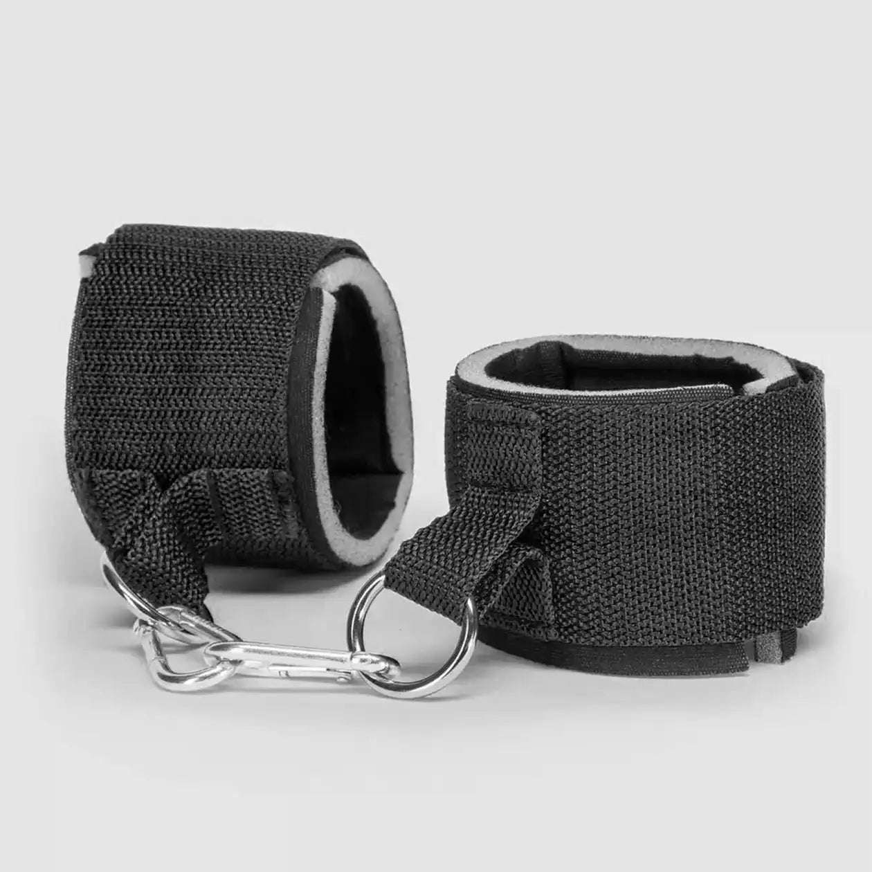 Black neck-to-waist restraint harness with adjustable collar, waist belt, padded wrist cuffs, and metal attachment rings