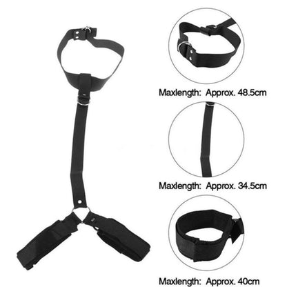 Black collar connected to adjustable wrist cuffs with a chest restraint harness.
