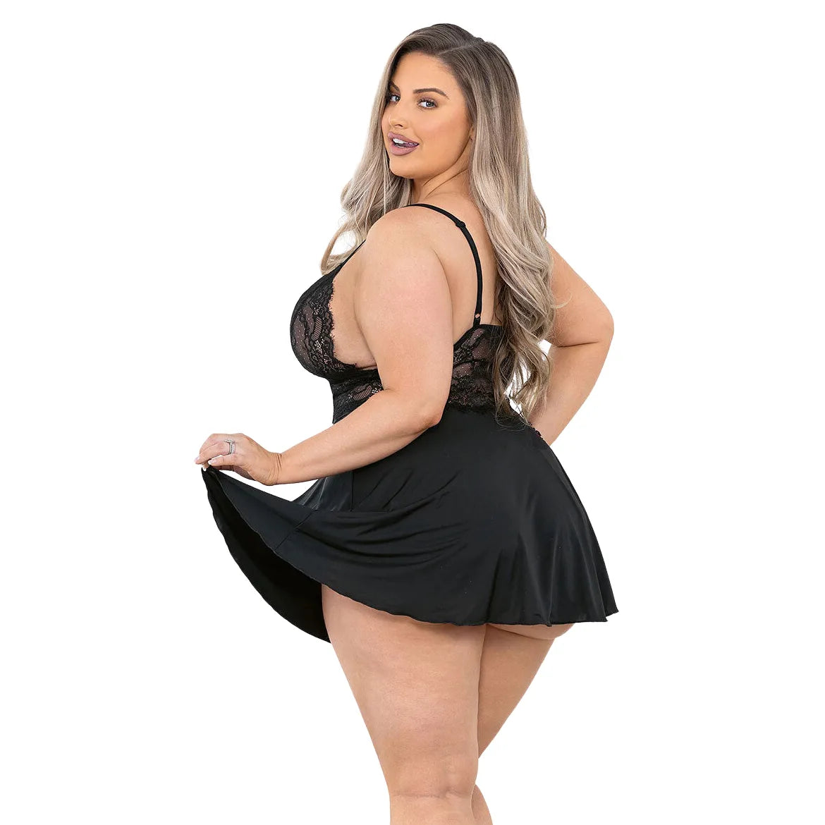 curvy woman wearing black satin babydoll lingerie with floral eyelash lace and deep plunge neckline
