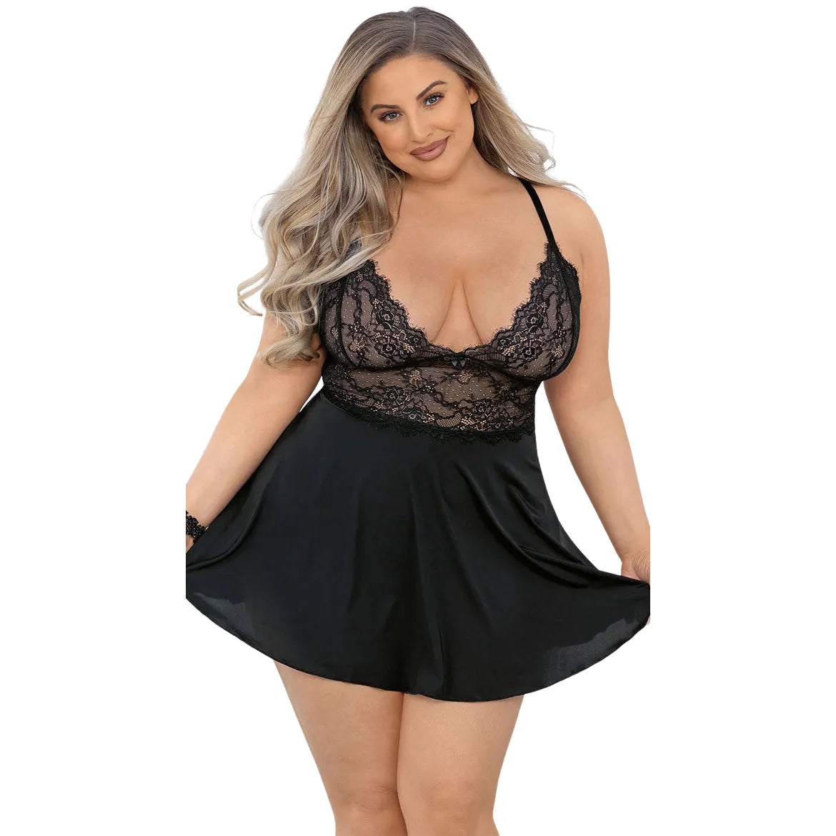 curvy woman wearing black satin babydoll lingerie with floral eyelash lace and deep plunge neckline
