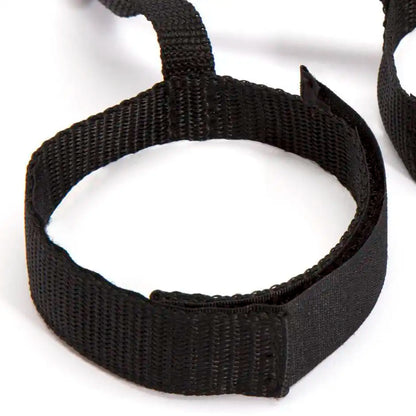 Adjustable full bed restraint set with wrist cuffs, ankle cuffs, and connecting straps.
