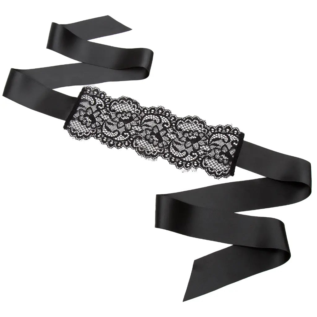 Black floral lace blindfold with satin ribbon tie for elegant sensory play and roleplay.