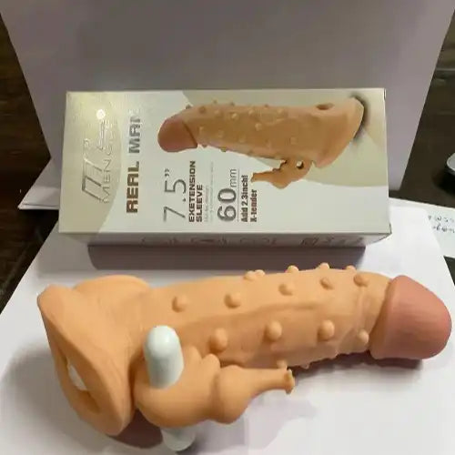 Men's extra ribbed elephant textured silicone sleeve with integrated vibration feature.