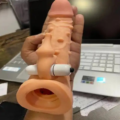Men's extra ribbed elephant textured silicone sleeve with integrated vibration feature.