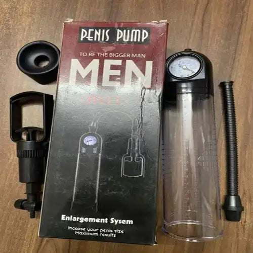 Men's manual vacuum pump system with transparent measurement cylinder and ergonomic hand pump.
