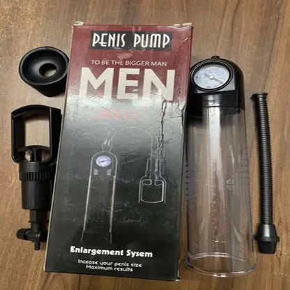 Men's manual vacuum pump system with transparent measurement cylinder and ergonomic hand pump.

