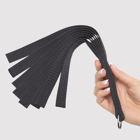 Black nylon flogger with multiple flexible woven tails and comfortable wrapped handle.