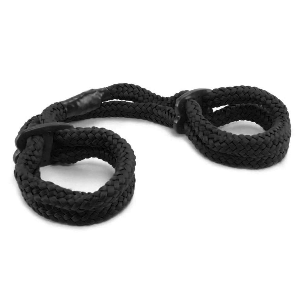Black nylon rope wrist restraint with adjustable wrist loops for roleplay and recreational use.