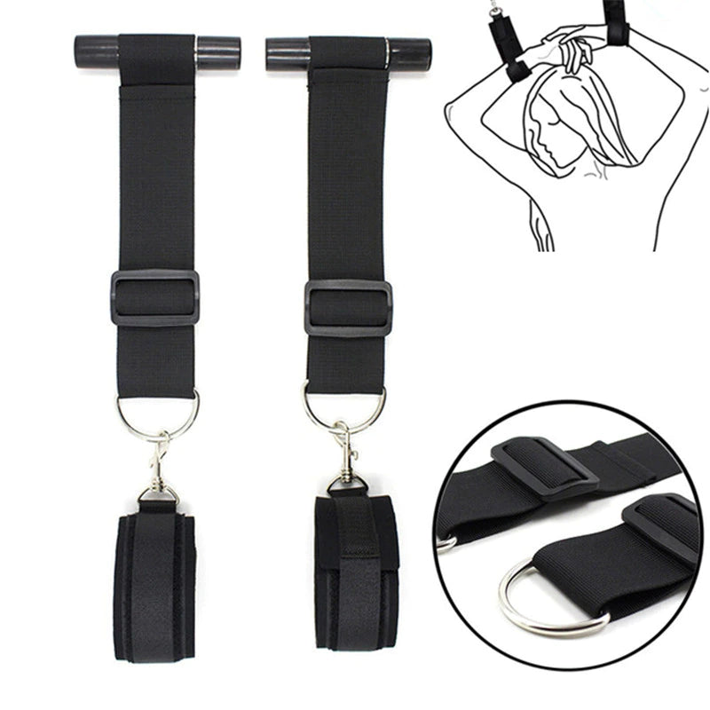 Black over-the-door restraint kit with adjustable straps and padded wrist cuffs attached to a door anchor system.