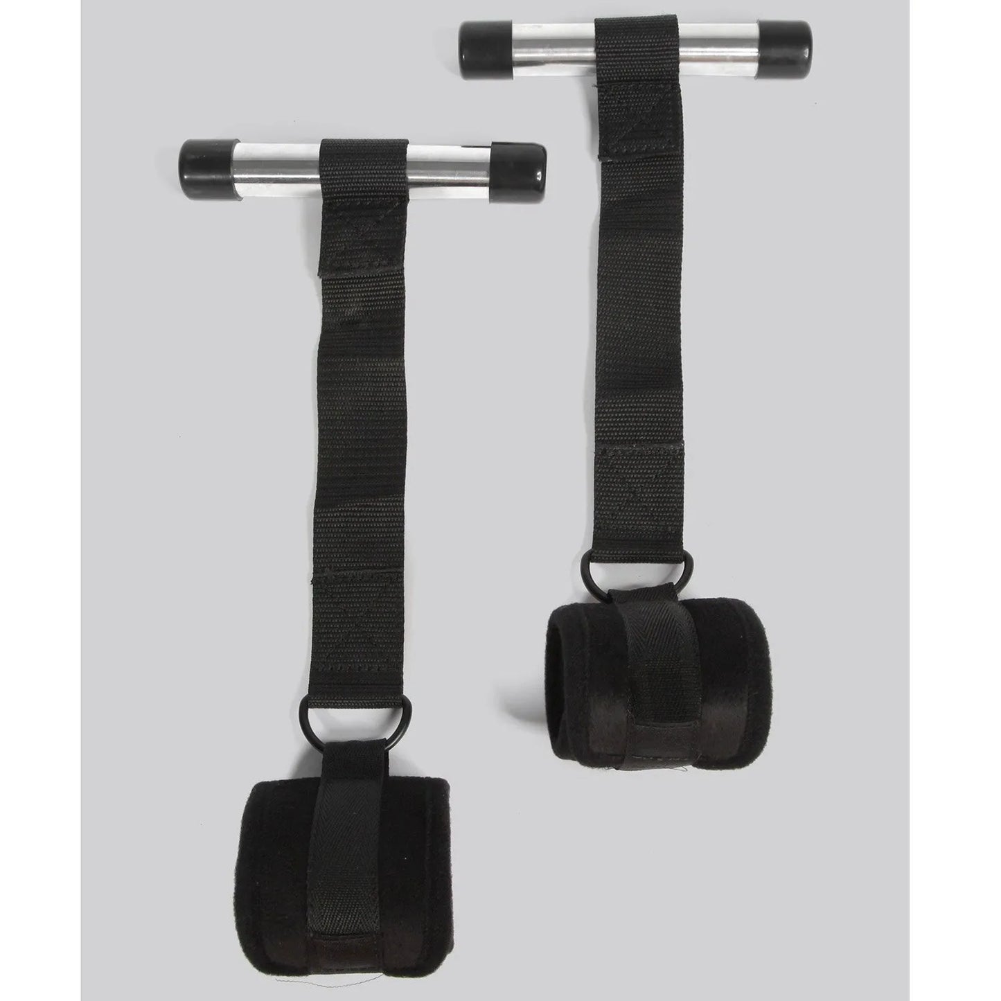 Black over-the-door restraint kit with adjustable straps and padded wrist cuffs attached to a door anchor system.