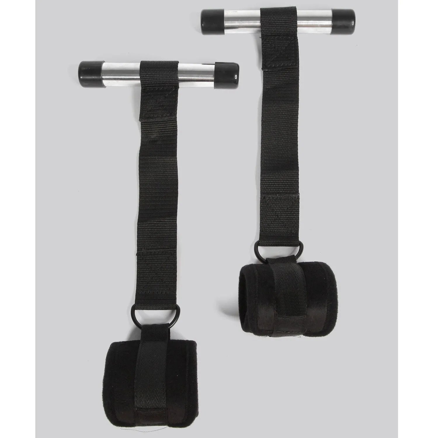 Black over-the-door restraint kit with adjustable straps and padded wrist cuffs attached to a door anchor system.
