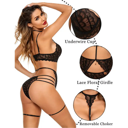 women's black multi-piece lingerie set featuring an underwired lace bustier with choker harness, matching garter belt, and strappy panties.
