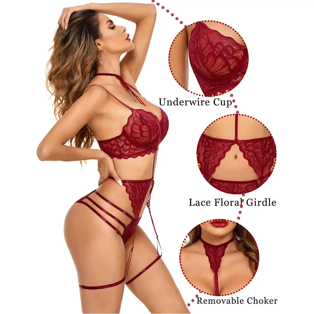 women's black multi-piece lingerie set featuring an underwired lace bustier with choker harness, matching garter belt, and strappy panties.
