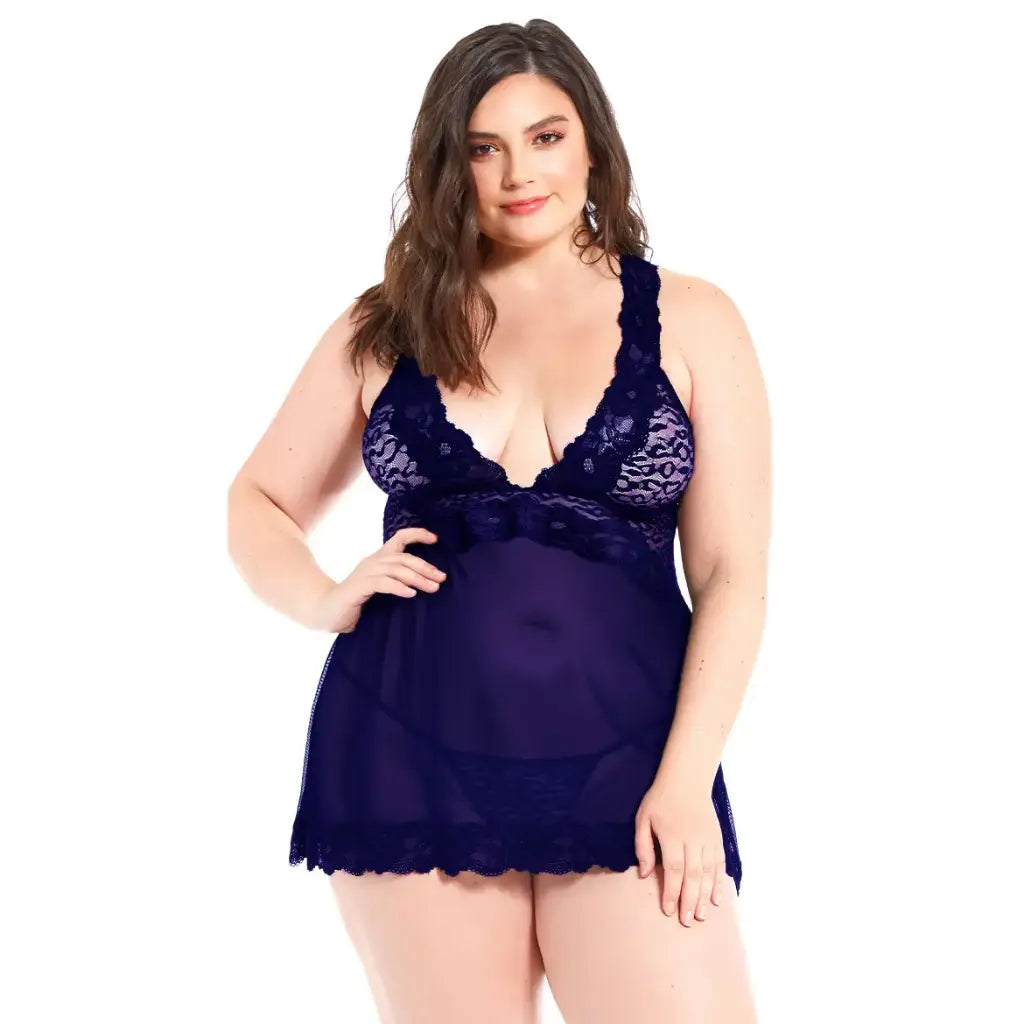 women's  navy blue lingerie set featuring a lace bodice babydoll with a sheer mesh skirt and matching G-string.