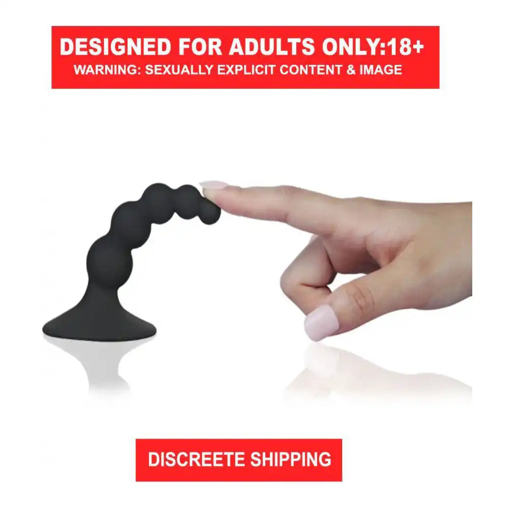 Black silicone anal beads plug with graduated bead design and suction cup base.
