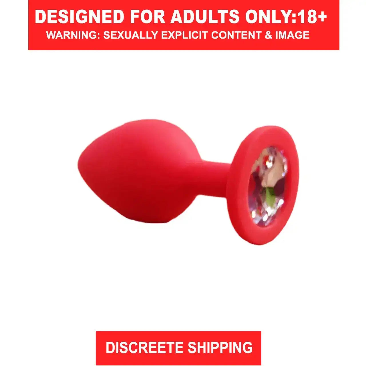 Red silicone butt plug with sparkling crystal gem base and smooth body-safe finish.