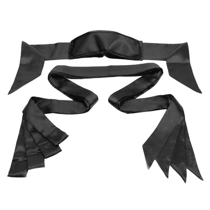 Satin bed restraint kit with blindfold, adjustable wrist cuffs, ankle restraints, and under-mattress straps.
