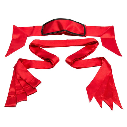 Satin bed restraint kit with blindfold, adjustable wrist cuffs, ankle restraints, and under-mattress straps.
