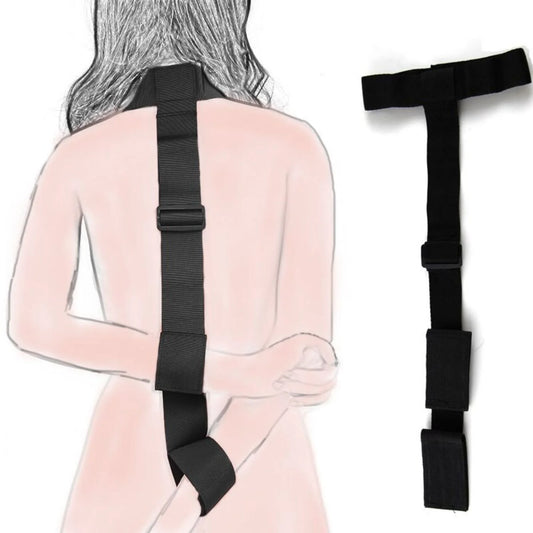 Black collar connected to an adjustable wrist restraint cuff with a nylon strap.