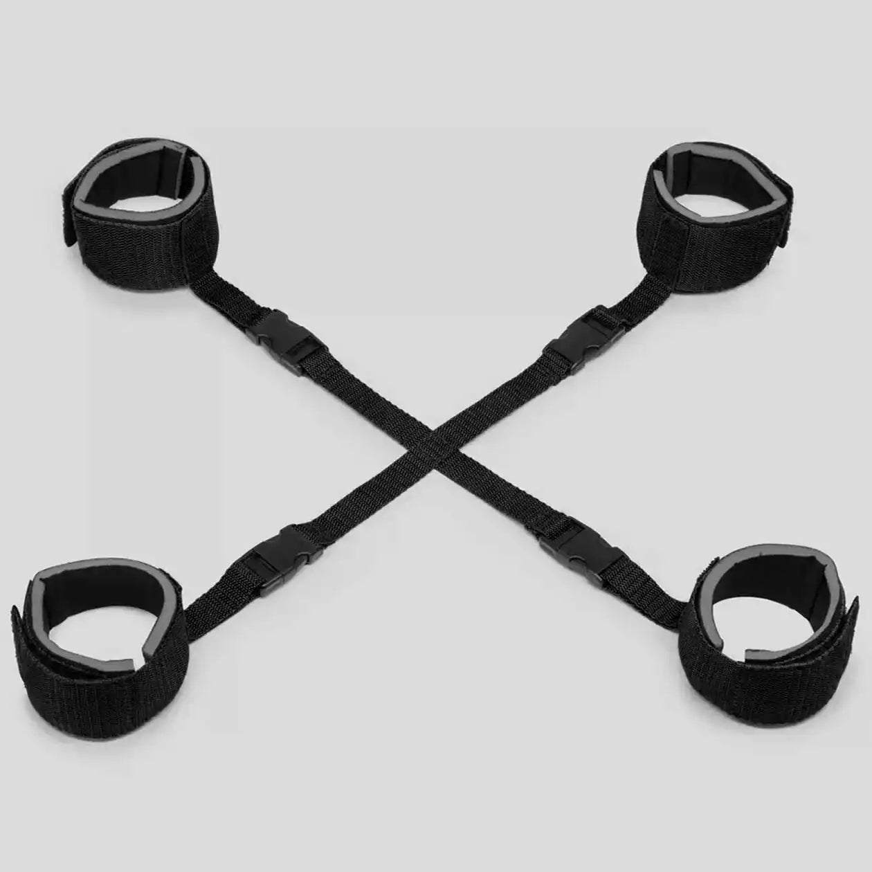 Black adjustable hogtie restraint set with wrist cuffs, ankle straps, and connecting nylon harness.