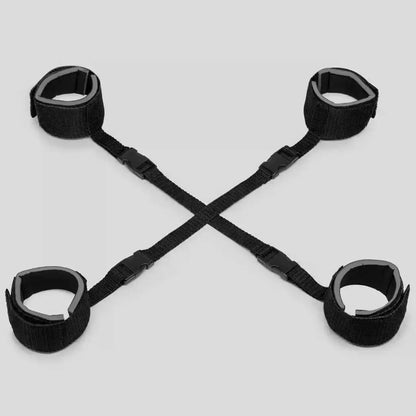 Black adjustable hogtie restraint set with wrist cuffs, ankle straps, and connecting nylon harness.